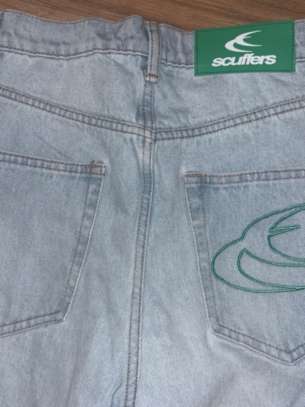 Scuffers Men's Light Blue Relaxed Fit Jeans with Green Logo Patch